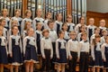 Children`s choir and soloists on stage before the start of the performance.