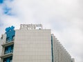 Moscow, Russia - September 14, 2019: Building with light tiling. At the top is Family doctor paid private clinic network logo and