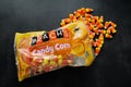 Moscow, Russia, September 2021: Candy corn Brachs spilled out of the pack. Halloween sweets. Copy space Royalty Free Stock Photo