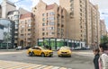 Moscow, Russia, September 2020: Car accident. Two taxi cars crashed at the empty crossroad. Drivers talk to each other near their