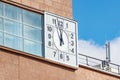 Moscow, Russia - September 21, 2019: Clock on the facade of building against blue sky on the street of Moscow. View of Moscow Royalty Free Stock Photo