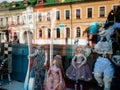 Dolls depicting fairytale heroes in a window of a Moscow Puppet Theater. Buildings opposite are reflected in glass