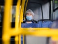 Moscow. Russia. September 24, 2020. Elderly women inside a city bus. On the faces of passengers are protective masks