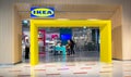 Moscow, Russia, September 2019: Entrance to the IKEA store. Two women friends look at the goods, the guard is on the left