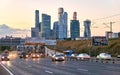 Evening traffic and sunset over skyscrapers of Moscow city business centre in early autumn Royalty Free Stock Photo
