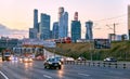 Evening traffic and sunset over skyscrapers of Moscow city business centre in early autumn Royalty Free Stock Photo