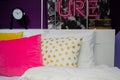 Moscow, Russia, September 2019: A fragment of a bedroom with purple walls, a pink pillow and a pattern of yellow polka dots. A Royalty Free Stock Photo