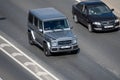 Moscow, Russia - September 27, 2022: German gray car Mercedes-Benz G-Class is driving on the road G-Wagen or Gelendvagen or GelÃÂ¤