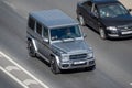 Moscow, Russia - September 27, 2022: German gray car Mercedes-Benz G-Class is driving on the road G-Wagen or Gelendvagen or GelÃÂ¤