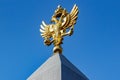 Moscow, Russia - September 13, 2019: Gilded russian double-headed eagle against deep blue sky in sunny day. Bottom view Royalty Free Stock Photo