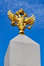 Moscow, Russia - September 13, 2019: Gilded russian double-headed eagle on the obelisk in honor of the 300th anniversary of the Royalty Free Stock Photo
