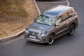 Moscow, Russia - September 27, 2022: Gray Japanese SUV Lexus LX driving down the road J200 Toyota Land Cruiser 200 LX570 500d