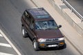 Moscow, Russia - September 27, 2022: Japanese brown and burgundy Nissan Pathfinder R50 car driving on the road Nissan Terrano old Royalty Free Stock Photo