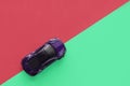 Moscow, Russia - 30 September, 2019. Kids toy car on trendy colorful background. Baby car top view on green and pink Royalty Free Stock Photo