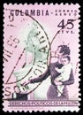 Postage stamp printed in Colombia shows Mother and Children, Issued to publicize women's political rights serie, 45 Colombian Royalty Free Stock Photo