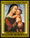 Postage stamp printed in Guinea-Bissau shows Madonna and Child, 1.50 Guinea-Bissau peso, 500th Anniversary of the Birth Raffaello Royalty Free Stock Photo