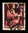 Postage stamp printed in Italy shows Peasant grafting a tree, Democracy serie, circa 1945