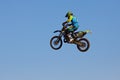 Moscow / Russia - September 23 2017: Pro motocross rider riding fmx motorbike, jumping performing extreme stunt. Professional