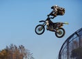 Moscow / Russia - September 23 2017: Pro motocross rider riding fmx motorbike, jumping performing extreme stunt. Professional