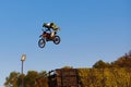 Moscow / Russia - September 23 2017: Pro motocross rider riding fmx motorbike, jumping performing extreme stunt. Professional Royalty Free Stock Photo