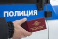 Moscow, Russia - September 20, 2018: service certificate in the hands of a policeman