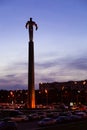 Titanium monument to first astronaut Yuri Gagarin on Gagarin Square at evening dusk.