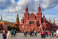 Moscow, Russia - September 30, 2018: Tourists walk on Red square on a background of State Historical Museum near Moscow Kremlin in Royalty Free Stock Photo