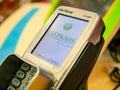 Moscow, Russia - September 14, 2019: Verifone VX820 POS credit card terminal reader for cashless sales. Sberbank logo on screen.