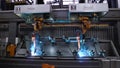 Moscow, Russia - September, 2018: Welding robots movement in car factory. Scene. Movement of robot when welding with