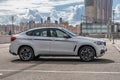 Moscow, Russia - 05 September 2019, white bmw x6m 50d parked on roof parking lot. Cloudy weather.