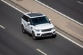 Moscow, Russia - September 27, 2022: White British-Indian SUV car Land Rover Range Rover Sport II rides on the road