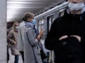 Moscow. Russia. September 28, 2020 A young girl in a protective mask stands on a subway station platform