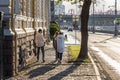 Tourists stroll along the embankment of the Moscow River against the Kremlin. Royalty Free Stock Photo