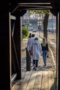 Tourists stroll along the embankment of the Moscow River against the Kremlin. Royalty Free Stock Photo