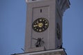 Tower clock on the spire of the North River Terminal Rechnoy Vokzal renovated Stalinist empire building. Vertical close up