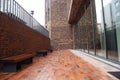 MOSCOW / RUSSIA - 04/04/2020 urban day shot of a red brick terrace with benches and stairs in front of a glass full height open Royalty Free Stock Photo