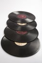 MOSCOW / RUSSIA - 04/05/2020 vertical isolated close up shot of a row of a stack of four old Soviet phonograph vinyls on a white