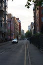 MOSCOW / RUSSIA - 20/04/2019 vertical shot of the Stolyarnyy Pereulok Street with its buildings, facades, fences cars and walking Royalty Free Stock Photo