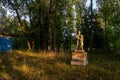 Very old sculpture of young pioneers a boy and a girl of Soviet Union in the park.