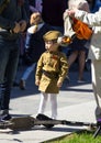 Victory Day in Moscow. Cute little Asian girl in military uniform on Victory Day. Royalty Free Stock Photo