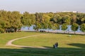 Young parents and their baby walking in the summer park. People on the nature.