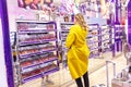 Moscow, Russia, 10/16/2018: A young woman chooses cosmetics in the shopping center