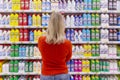 Moscow, Russia, 11/22/2018. Young woman in store chooses cleaning product, view from the back