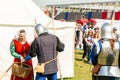 Moscow Russian Federation 01.05.2018. Cosplay man in clothes of a medieval soldier takes a basket of food from a young woman in a