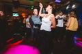 MOSCOW, RUSSIAN FEDERATION - OCTOBER 13, 2018: A middle-aged couple, a man and a woman, dance salsa among a crowd of dancing peopl Royalty Free Stock Photo