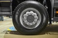 MOSCOW, SEP, 5, 2017: Close up view on Volvo truck front axle wheels and tires. Truck wheel rim. Truck chassis exhibit on Commerci