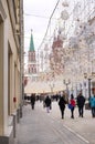 Moscow street in the city center in the winter, people walk down the street