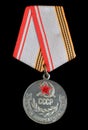 Moscow, USSR - CIRCA 1984: Soviet medal `Veteran of the Armed Forces of the USSR`, isolated on black background