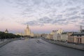 Moscow view at dusk. Clouds create special atmosphere. Kotelnicheskaya skyscraper and boat tours by Moscow river. Russia