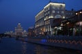 Moscow. Walk on the Moscow River on the boat. Night view of Raushskaya embankment and a high-rise building on Kotelnicheskaya